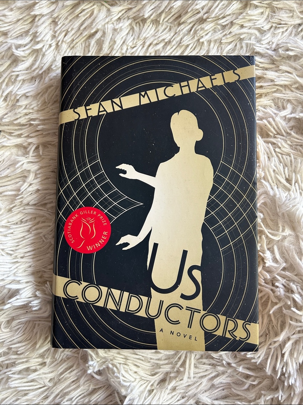 Us Conductors by Sean Michaels - Black & Gold Hardcover, Giller prize